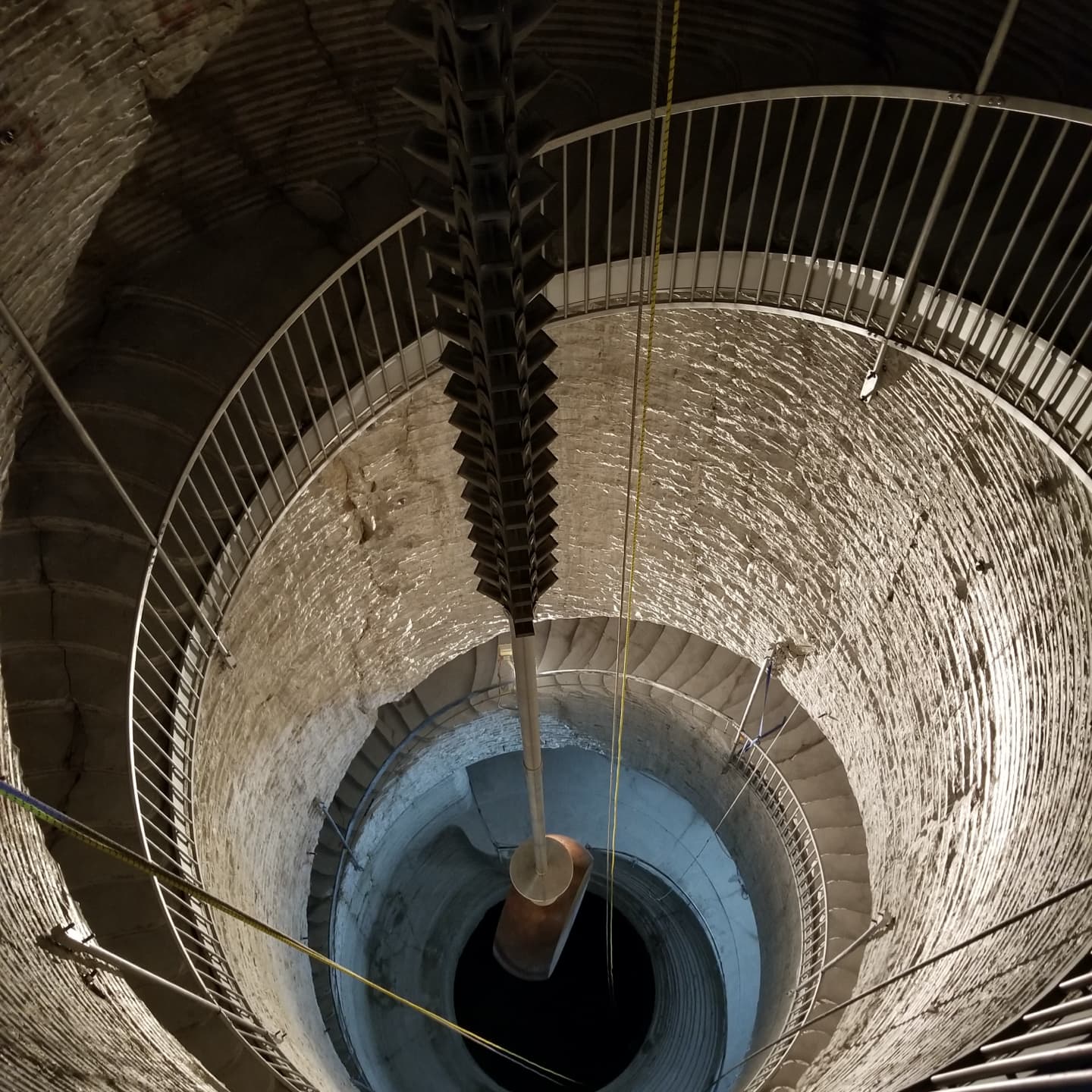 Standing on the staircase, looking at the drive weight below
